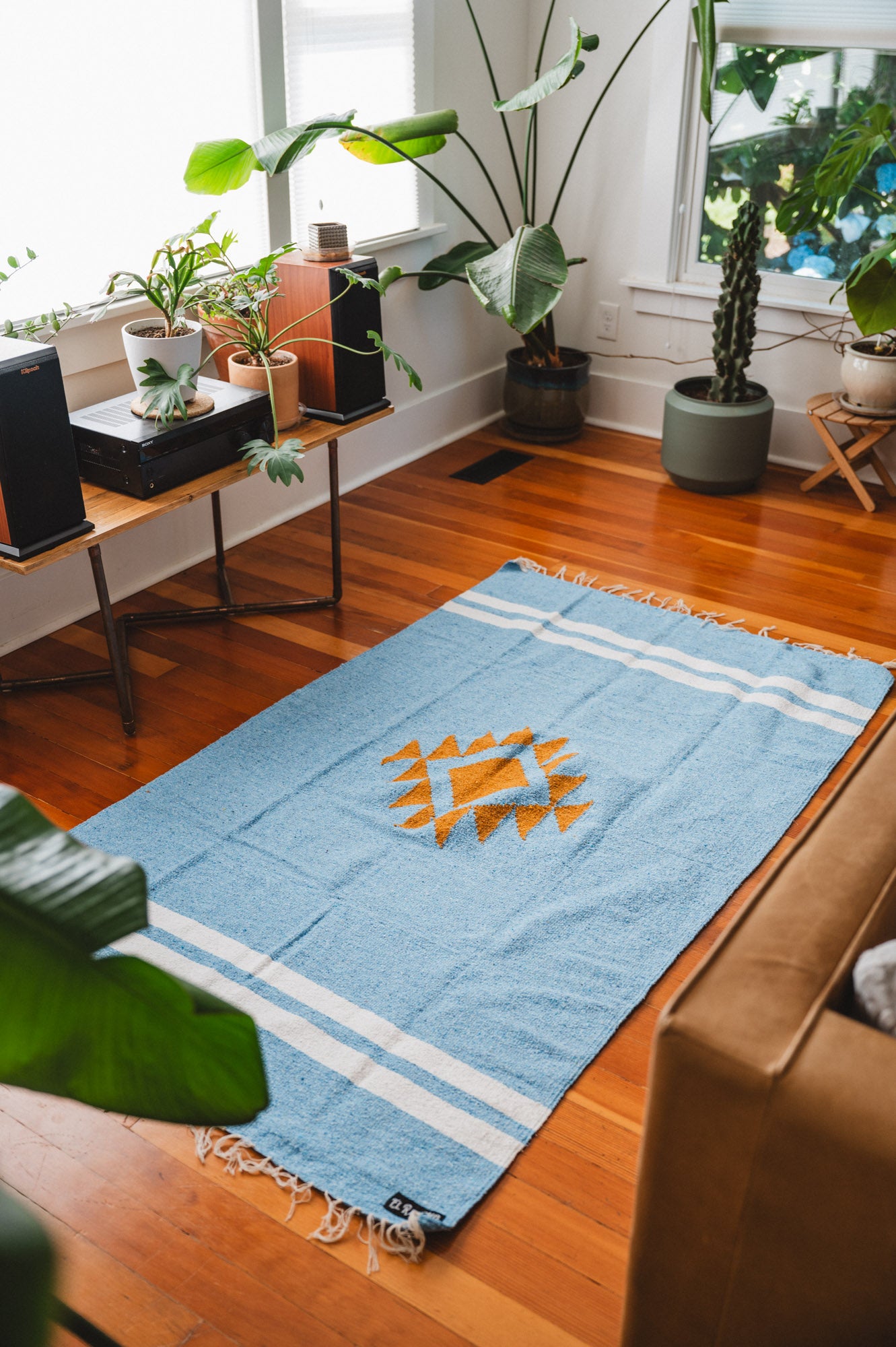 Blue and gold diamond blanket on the floor