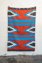 Red blue and black southwestern diamond handwoven blanket 