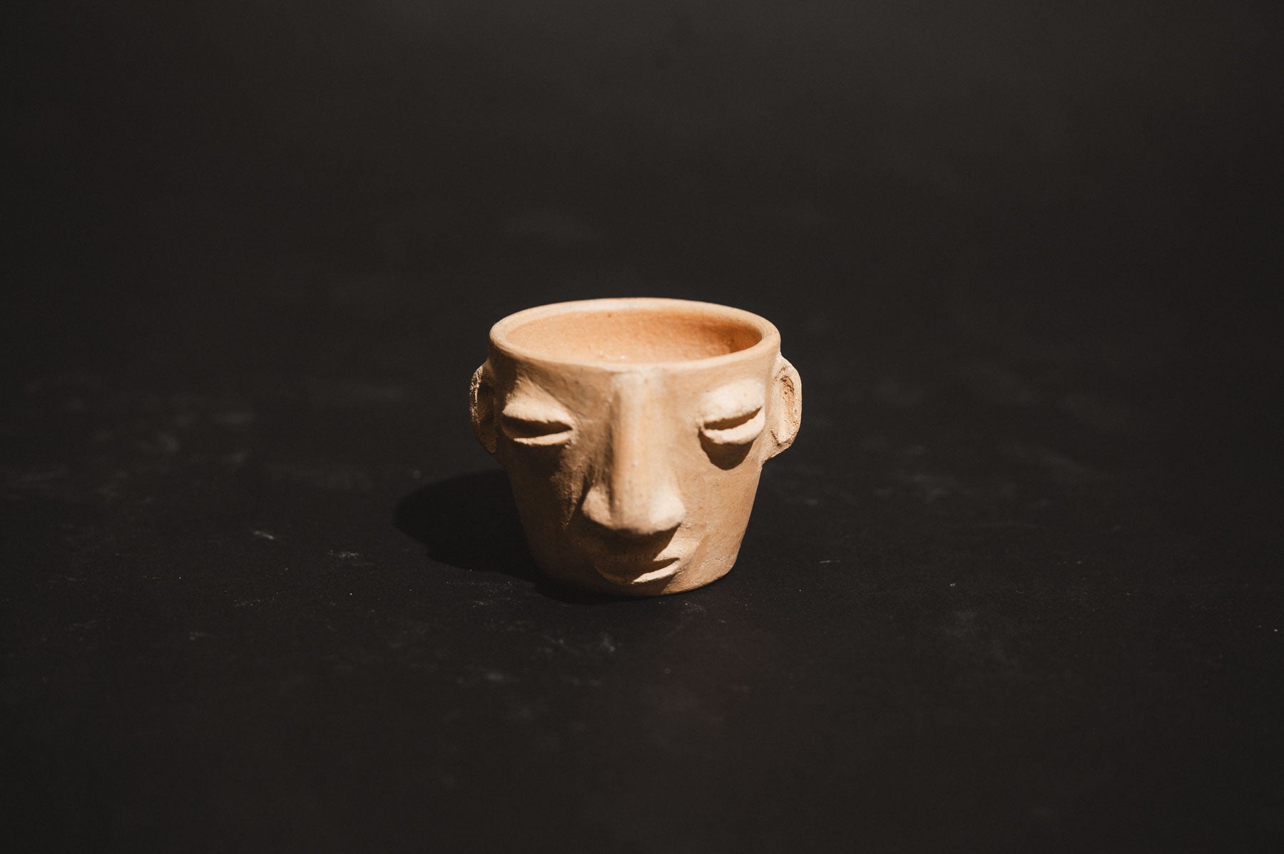 Handmade clay carita mezcalero cups from Oaxaca