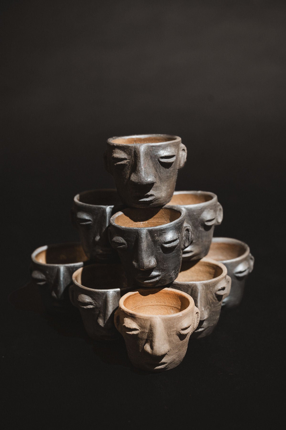 Handmade barro negro clay carita mezcalero cups from Oaxaca