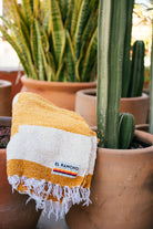 Folded blanket sitting on clay pots