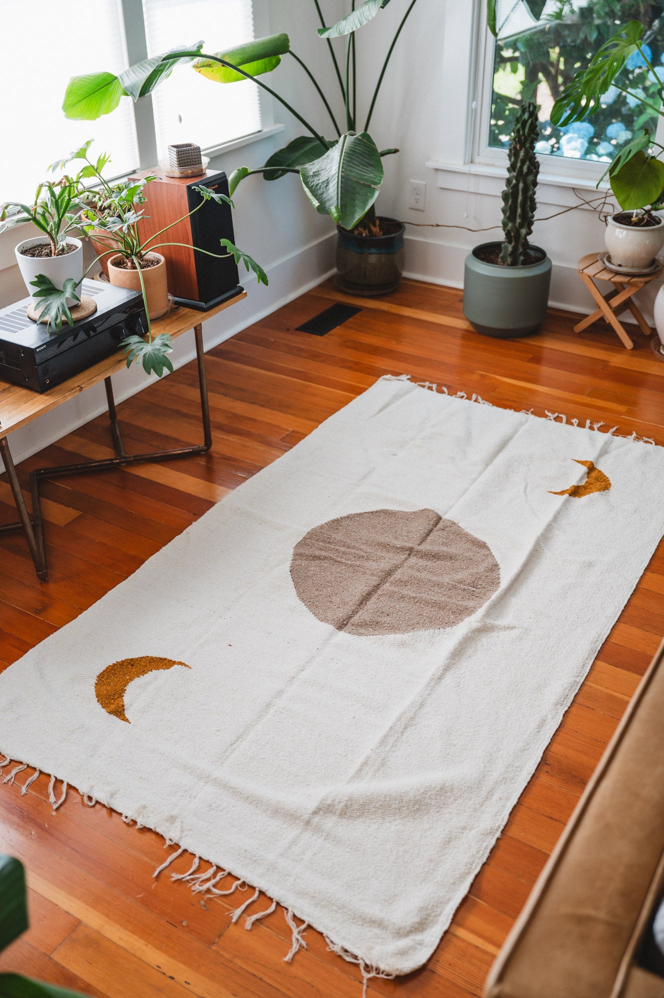 Cream solar lunar blanket on floor