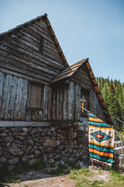 Diamond blanket in front of cabin on the mountain