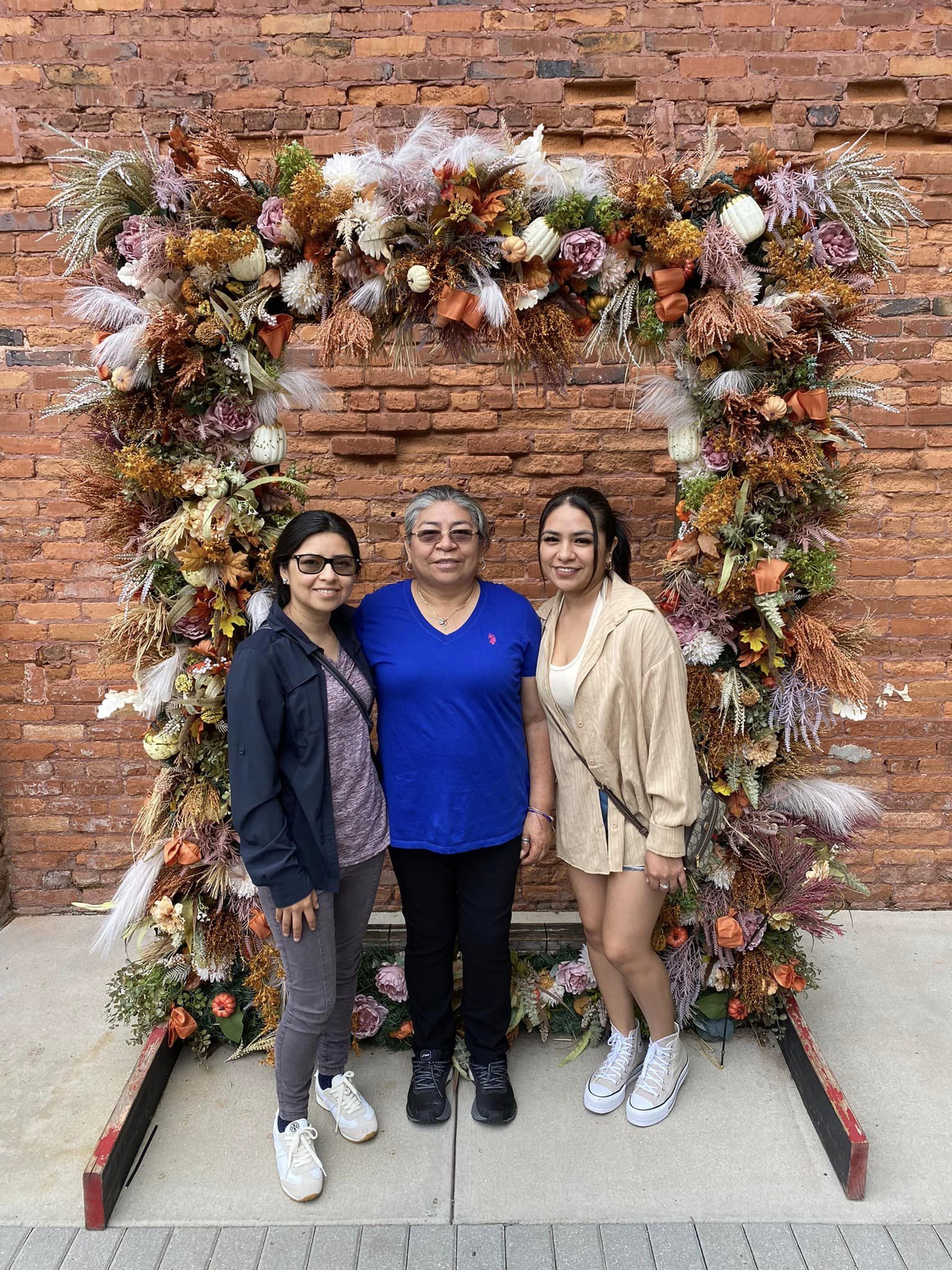 Family portrait of mother and two sisters