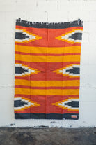 Red yellow and black handwoven southwestern style blanket